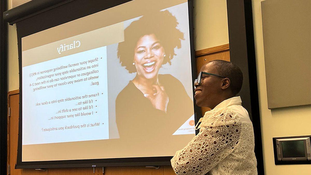 A woman presenting at a conference.