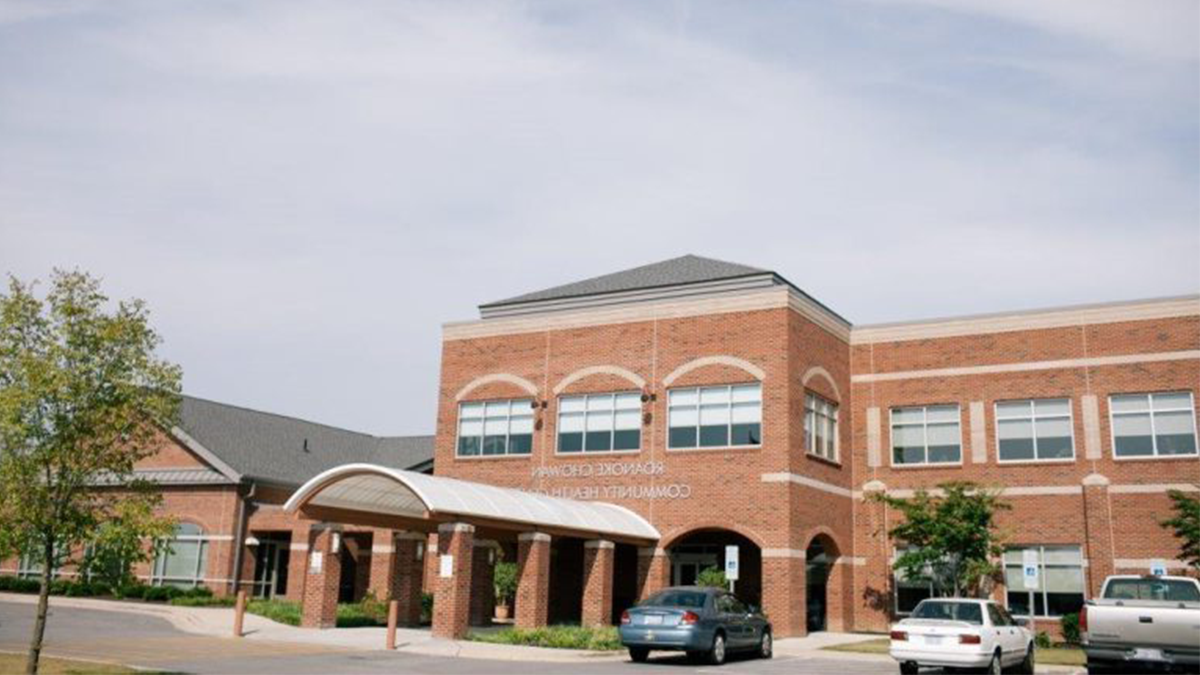 Exterior building image of Roanoke Chowan Community Health Center underneath cloudy sky.